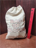 CHILD'S BAG OF WOOD BLOCKS IN BAG