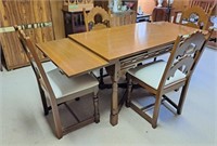 Dining room table with 4 chairs and 2 pull out