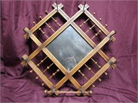 Antique spool mirror w/hooks & bar.