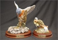 Two Royal Doulton birds on wooden stands