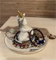 Unicorn jewelry holder with jewelry.