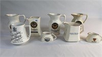 8 ASSORTED ADVERTISING WHISKY JUGS INCLUDES