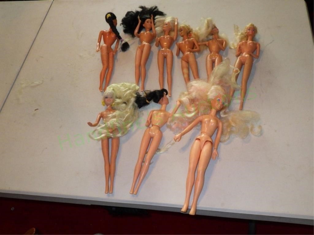 9 Barbi Dolls