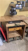 Sears Craftsman radial saw on a handmade metal