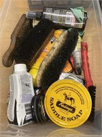 Container full of shoeshine products