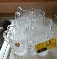 Two sets of four crystal coffee mugs