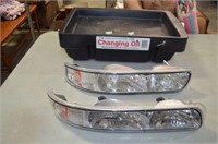 OIL CHANGING CONTAINER AND AUTOMOTIVE LIGHTS