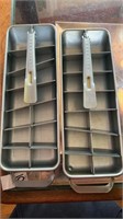 Two metal quickcube trays and two metal funnels