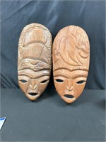 2 wood masks w different details on headdress