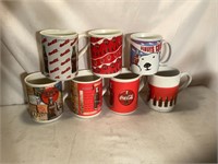 Variety of Coca Cola coffee cups