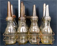 Lot of 8 vintage oil bottles w/ rack