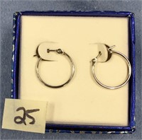 Pair of silver toned earrings