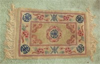 small sculptured Chinese rug needs cleaning 28" x