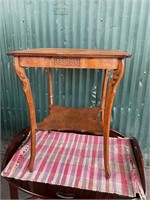 Antique carved wormy, chestnut side table w/shelf