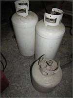 3 empty propane tanks