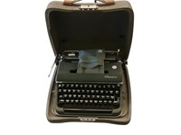 Vintage Olympia cased portable typewriter