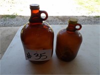2) brown glass jugs