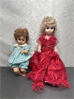 2 plastic dolls