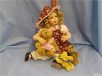 Doll with 3 teddy bears