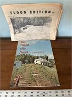 Rapid City flood book and newspaper