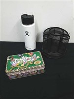 Rolodex pen holder, a Girl Scout tin, and small