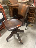 Antique wood rolling chair. 

Refbooth47