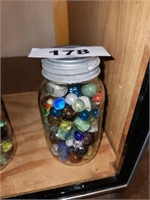 MASON JAR OF VARIOUS MARBLES