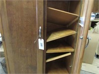 Two door wood cabinet w/7 shelves