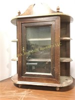 Old shelving unit with glass door