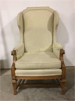Vintage winged back chair with a pecan finish