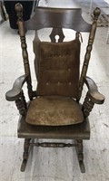 Vintage wooden rocking chair with corduroy style