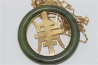 Large oriental green stone pendant