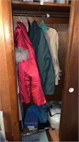 Lot of Coats and bottom of closet