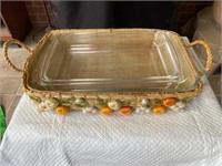 Three glass cooking dishes with basket carrier