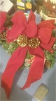 Pair of small holiday wreaths with red ribbon a
