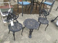 2 small metal chairs and table