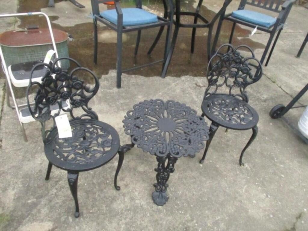 2 small metal chairs and table