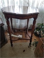4 legged table with lacy cover