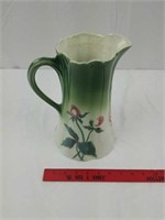 Antique pitcher with floral design