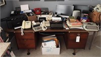 Vintage office desk full of office supplies to