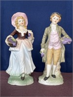 Vintage porcelain figurines holding grapes