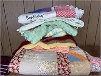 Tattered hand made quilt and afghans, baby
