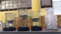 Glass bag jar, 3 glass candle holders, on wood