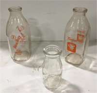 Glass advertising milk jugs