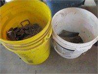 2 buckets w/misc hammer heads, bolt pins