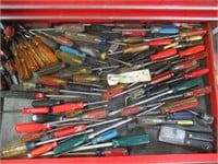 Contents of drawer that includes screwdrivers.