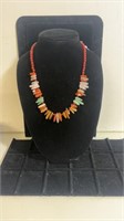 Mid length Multicolored Orange Agate Tooth and
