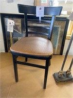 2 used Black wood chairs tan vinyl seat