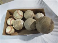 old baseballs and softballs