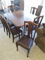 Wooden dining room table with six Chairs